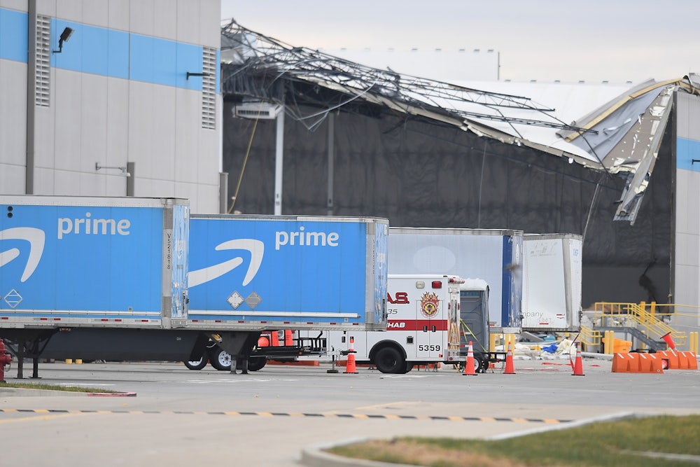 Amazon truck cabs are seen outside a damaged Amazon Distribution Center