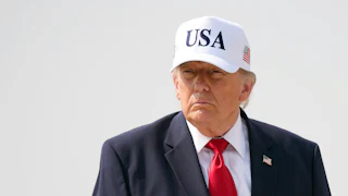Donald Trump wearing a USA cap