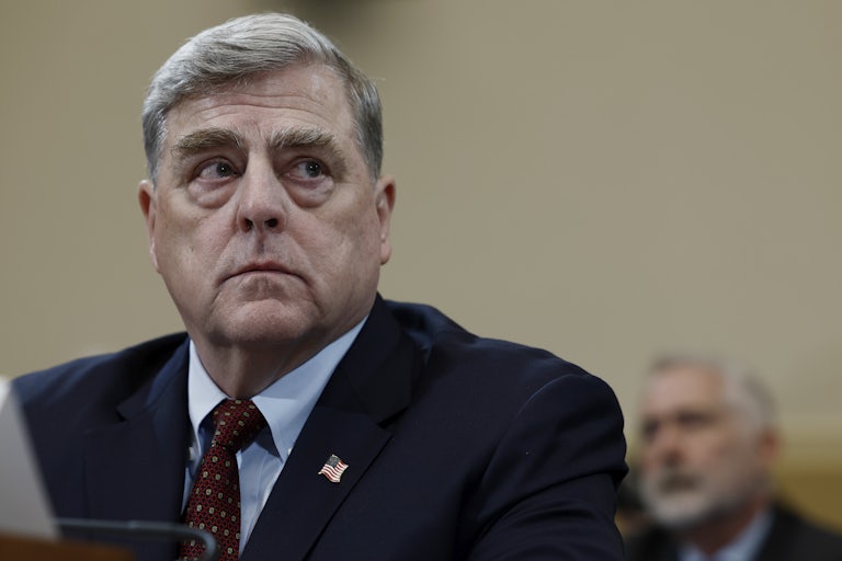 Retired General Mark Milley looks to the side during a House committee hearing