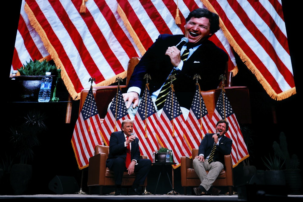 Trump in conversation with Tucker Carlson at the Desert Diamond Arena in Phoenix