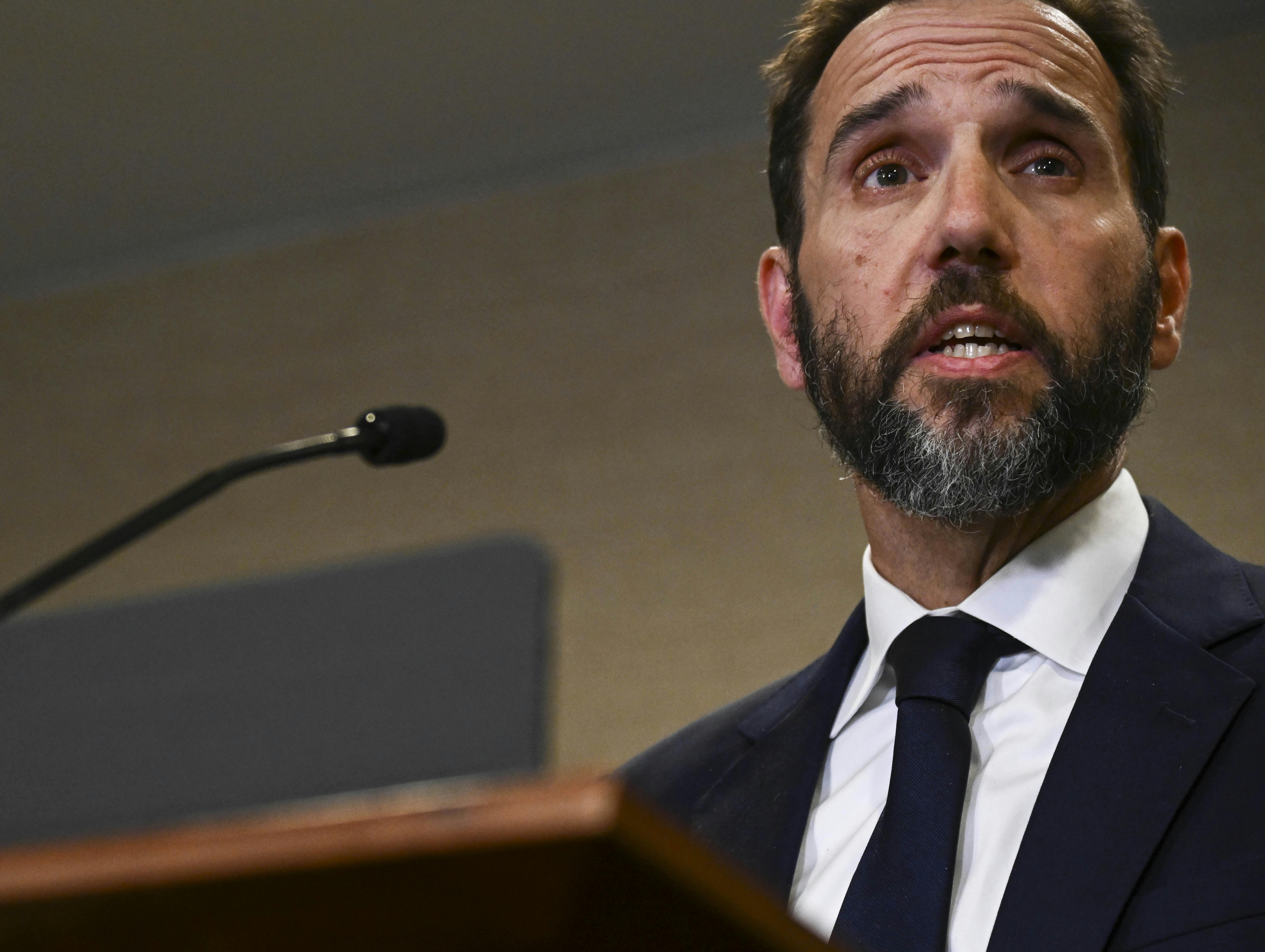 Special counsel Jack Smith speaks at a podium