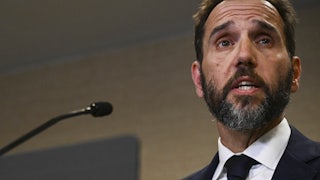 Special counsel Jack Smith speaks at a podium