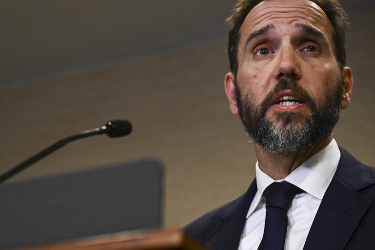 Special counsel Jack Smith speaks at a podium