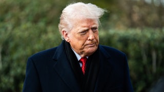 Donald Trump purses his lips while standing outside the White House