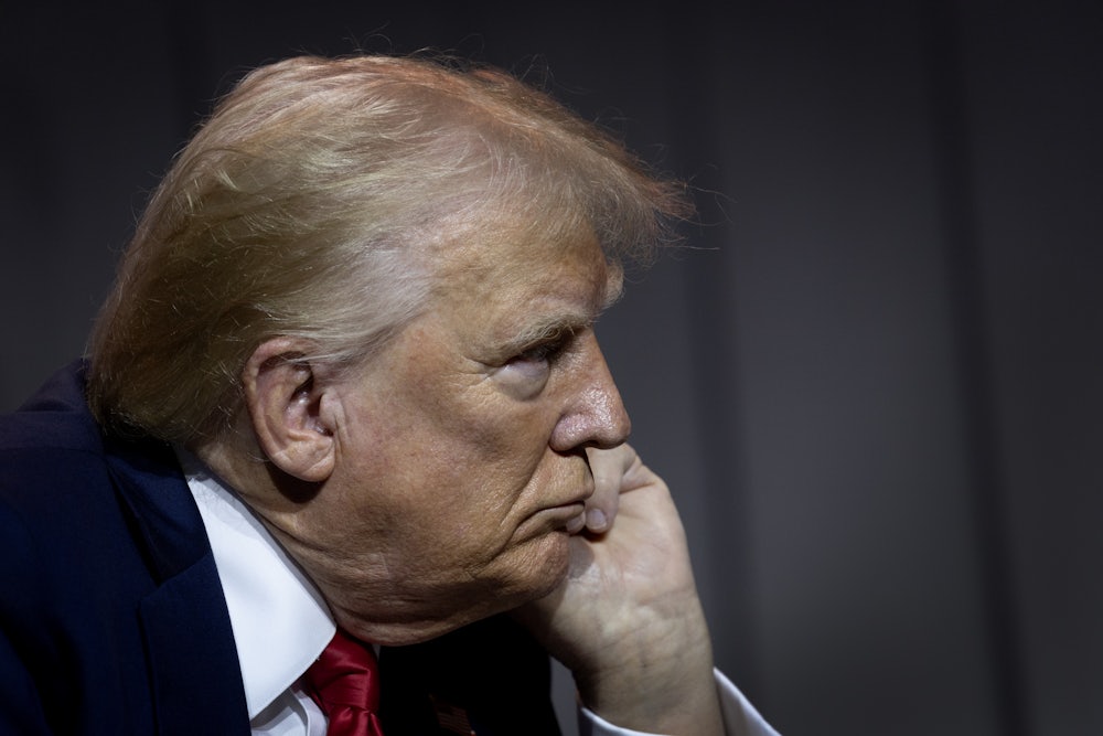 Donald Trump rests chin on hand
