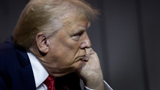 Donald Trump rests chin on hand