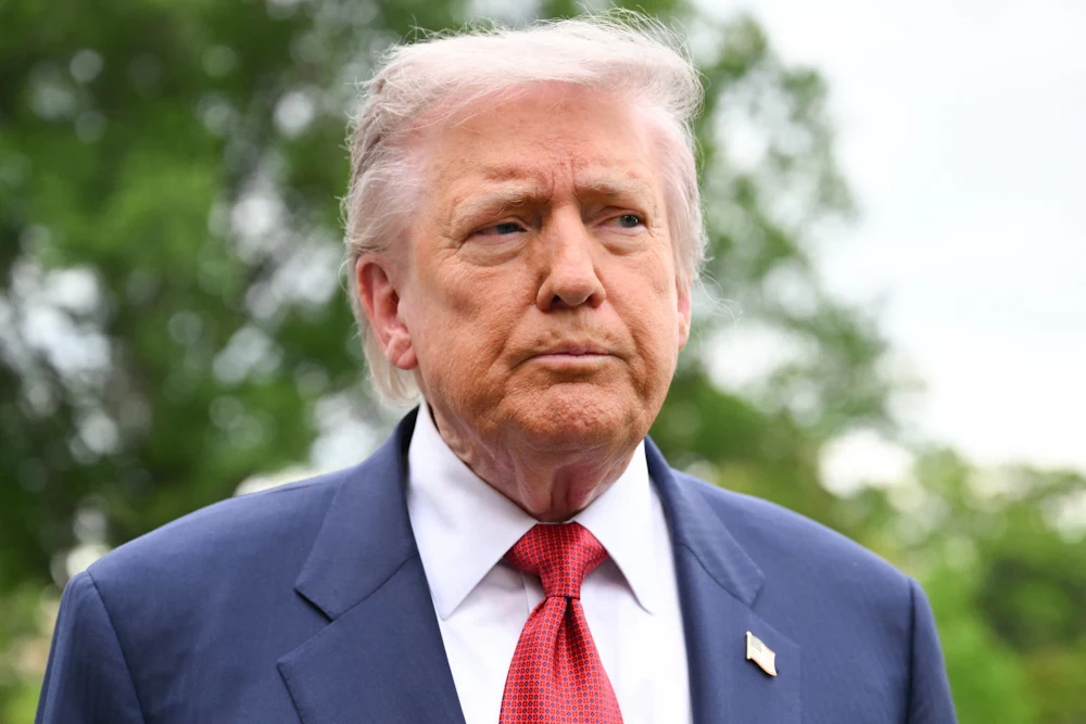 Donald Trump looks sideways to his left, appearing perplexed
