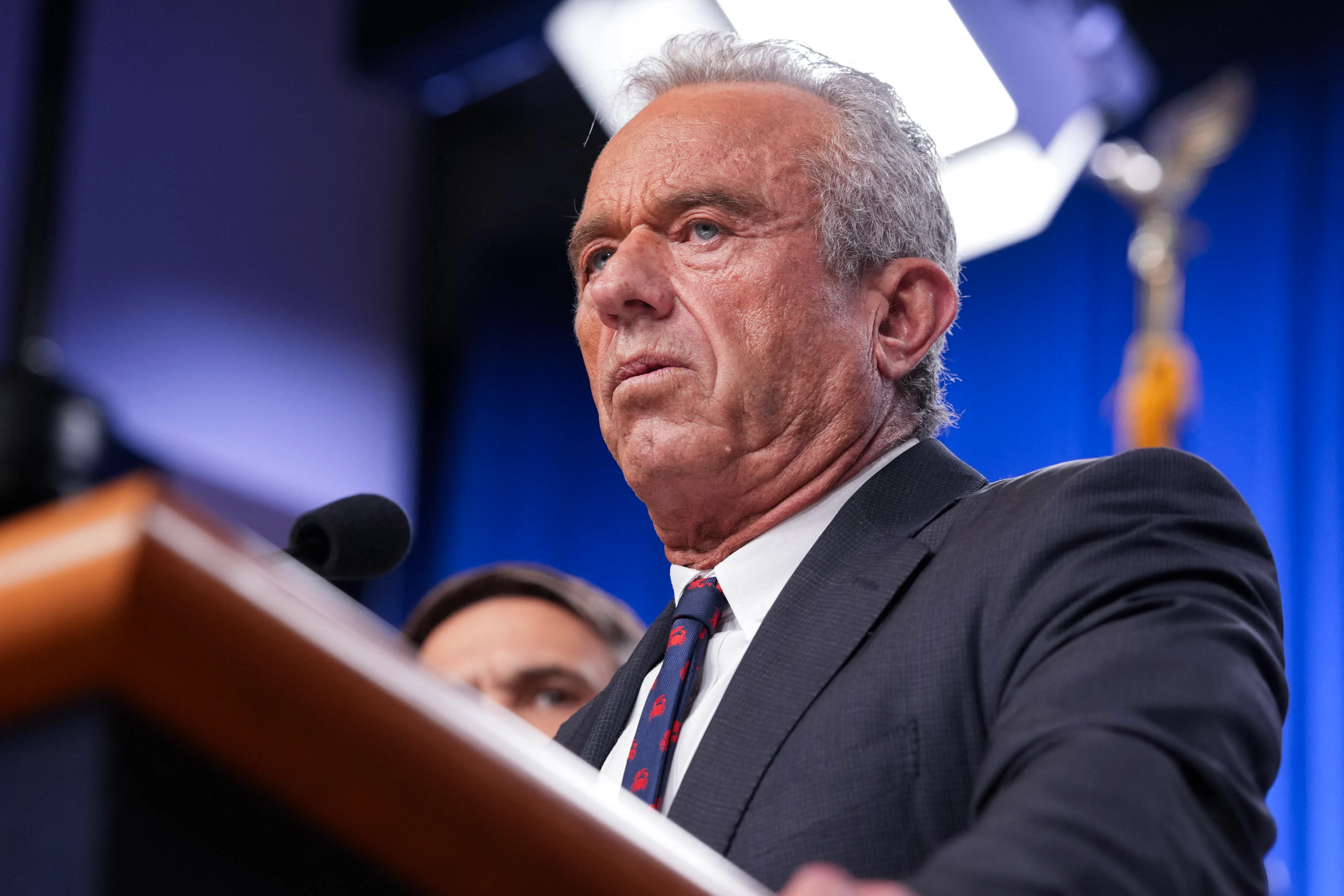Robert F. Kennedy Jr. speaking at a podium