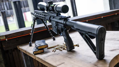 AR-15 pointed out the window
