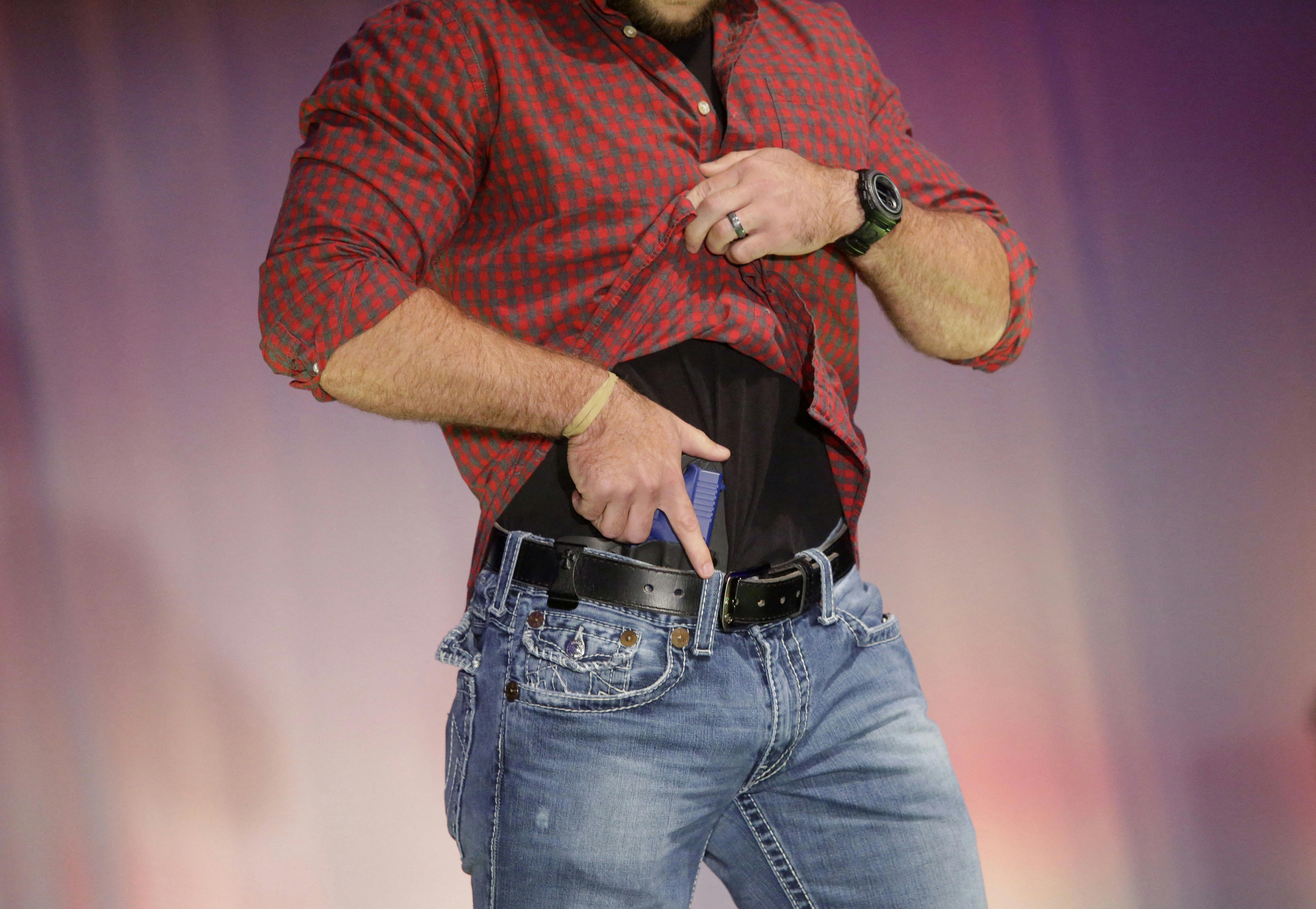 A model walks the runway during the NRA Concealed Carry Fashion Show in Milwaukee, Wisconsin.