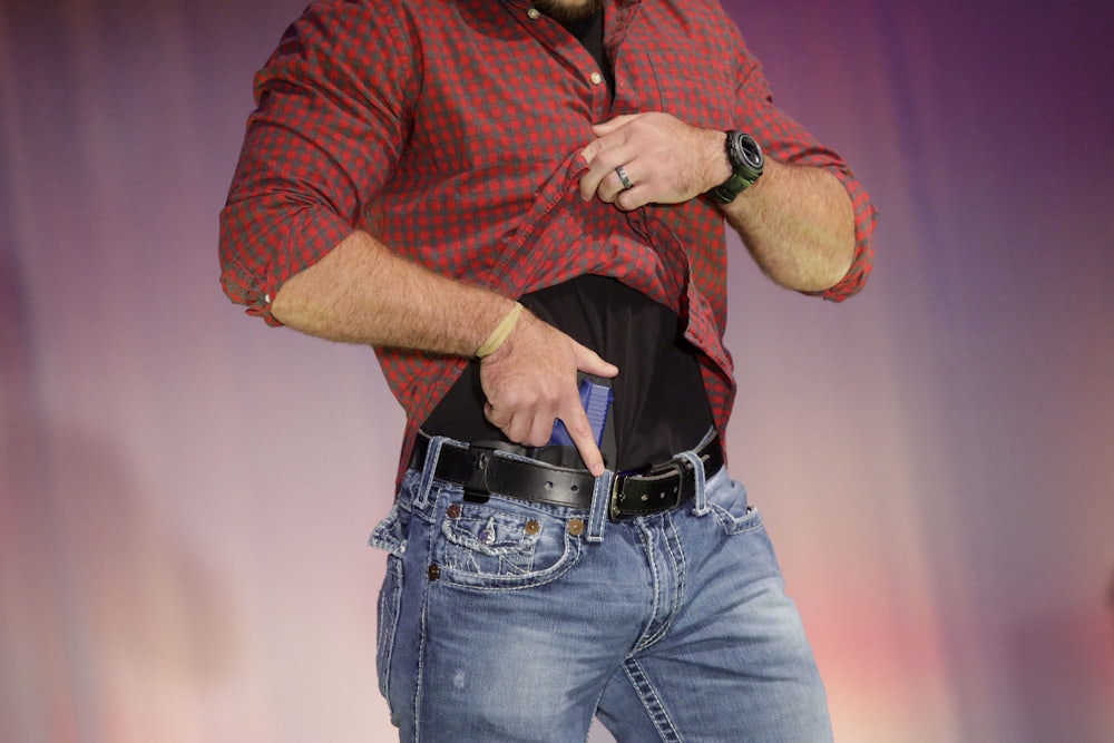 A model walks the runway during the NRA Concealed Carry Fashion Show in Milwaukee, Wisconsin.
