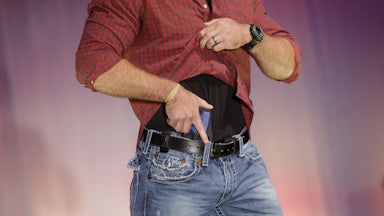 A model walks the runway during the NRA Concealed Carry Fashion Show in Milwaukee, Wisconsin.