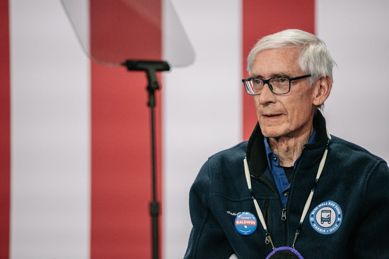 Wisconsin Governor Tony Evers stands at an event