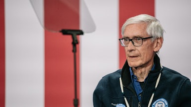 Wisconsin Governor Tony Evers stands at an event