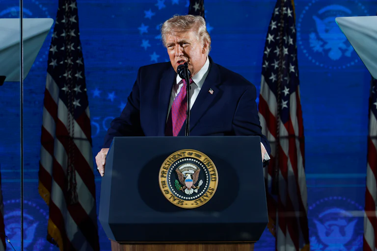 Donald Trump speaking at a podium