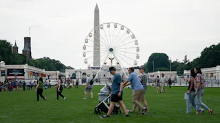 People walk at the Great American State Fair during the Freedom 250 celebrations