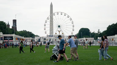 People walk at the Great American State Fair during the Freedom 250 celebrations