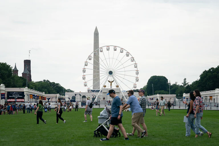 People walk at the Great American State Fair during the Freedom 250 celebrations