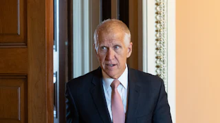 Senator Thom Tillis walks in the Capitol