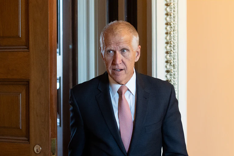 Senator Thom Tillis walks in the Capitol