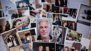 Photos of Jeffrey Epstien and his friends and acquaintances spread across a table.