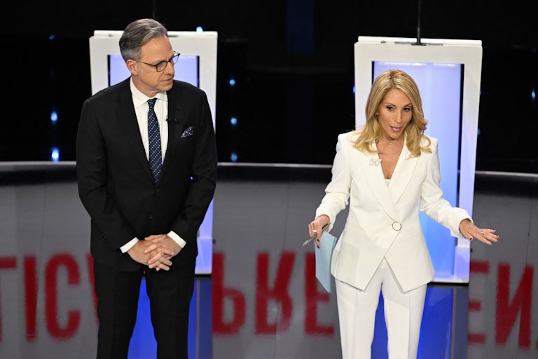 Jake Tapper and Dana Bash stand on stage before the presidential debate between Donald Trump and Joe Biden