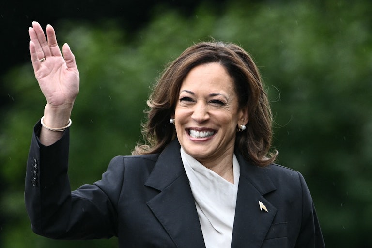 Kamala Harris smiles and waves
