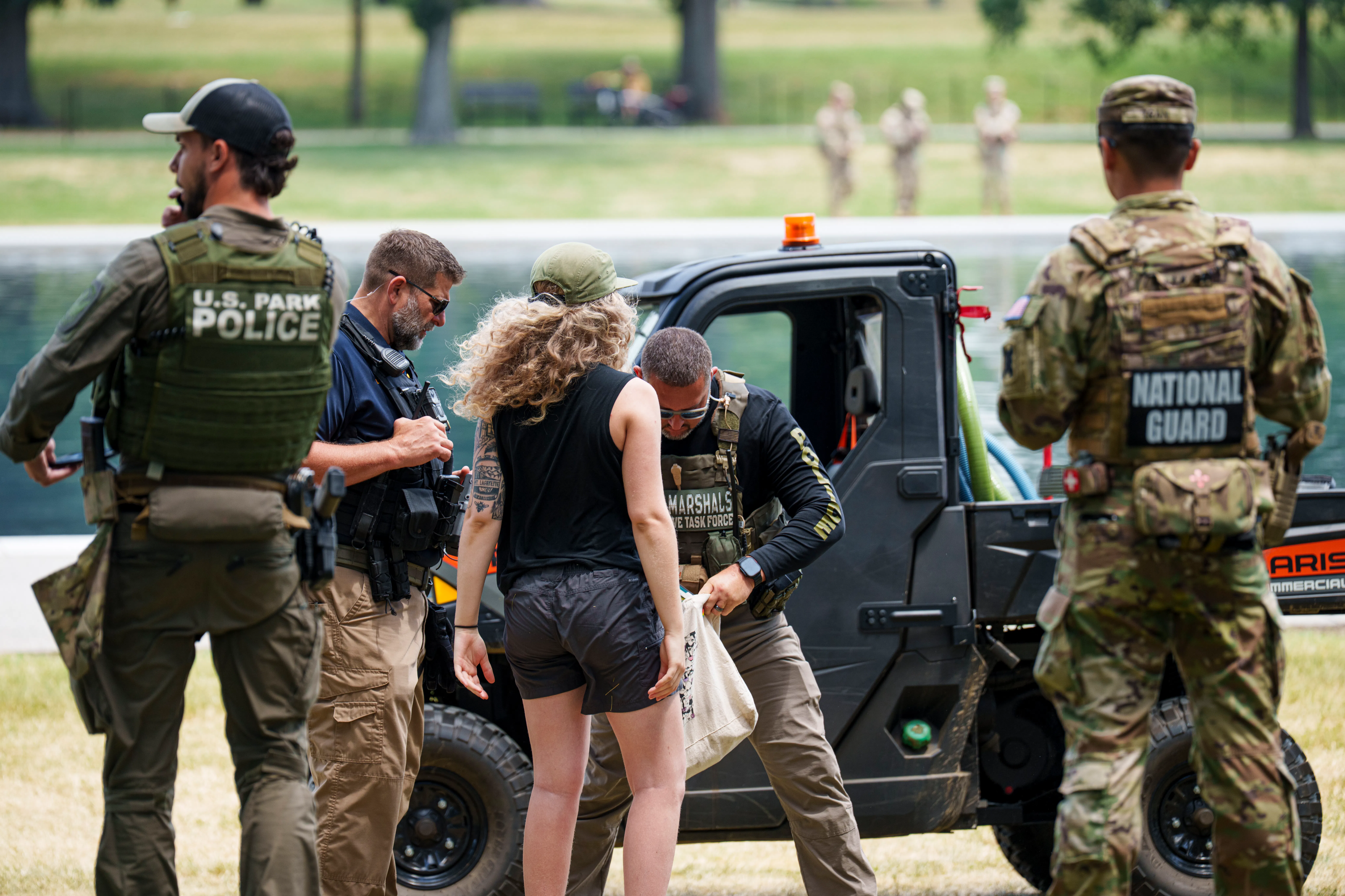 On June 22, a U.S. Marshall officer searched the bag of a woman who was detained for dipping her hand into the Lincoln Memorial Reflecting Pool. 