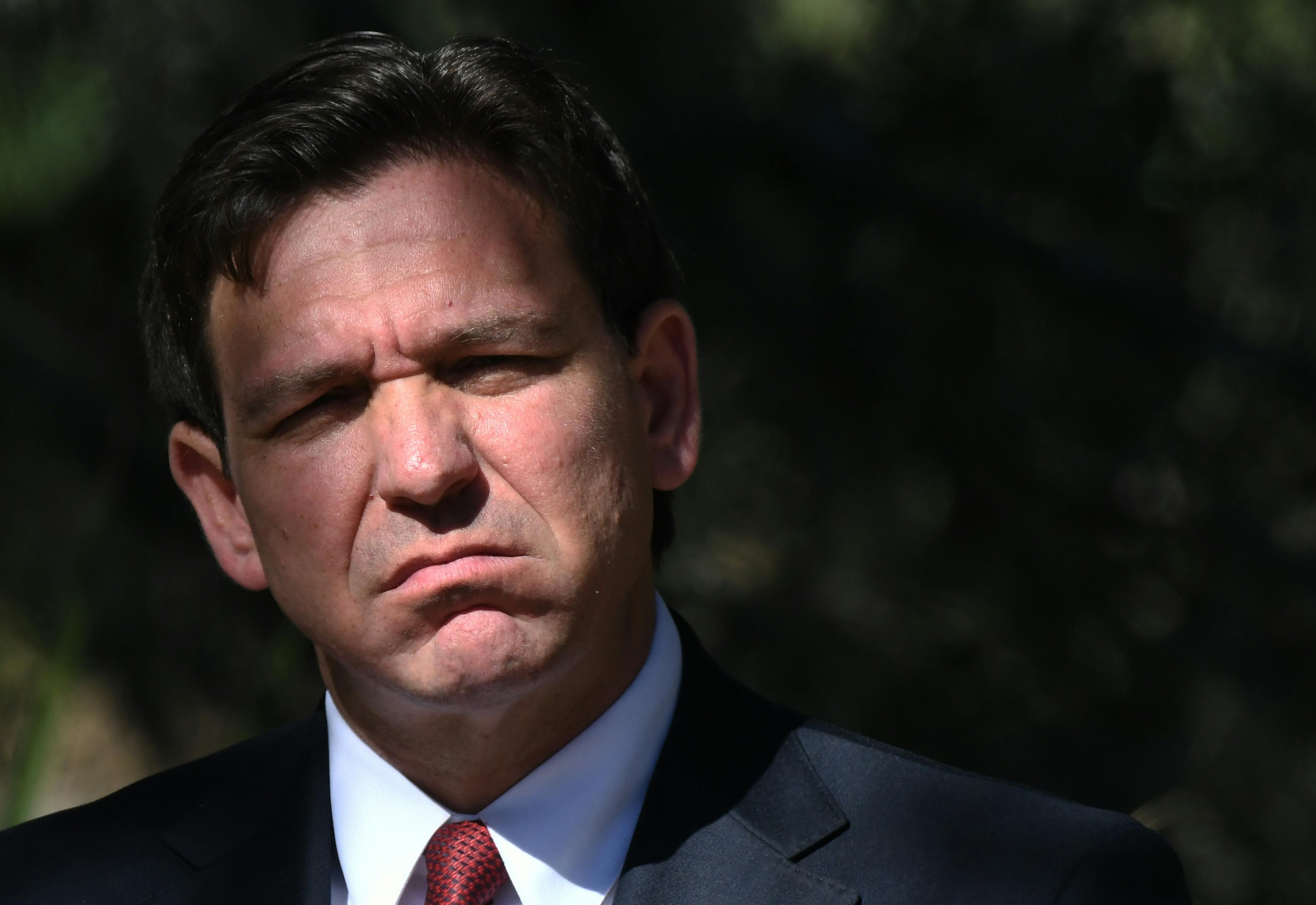 Ron DeSantis frowns into the sun.