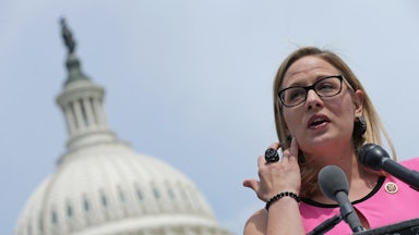 Arizona Senator Kyrsten Sinema stands outside the U.S. Capitol.