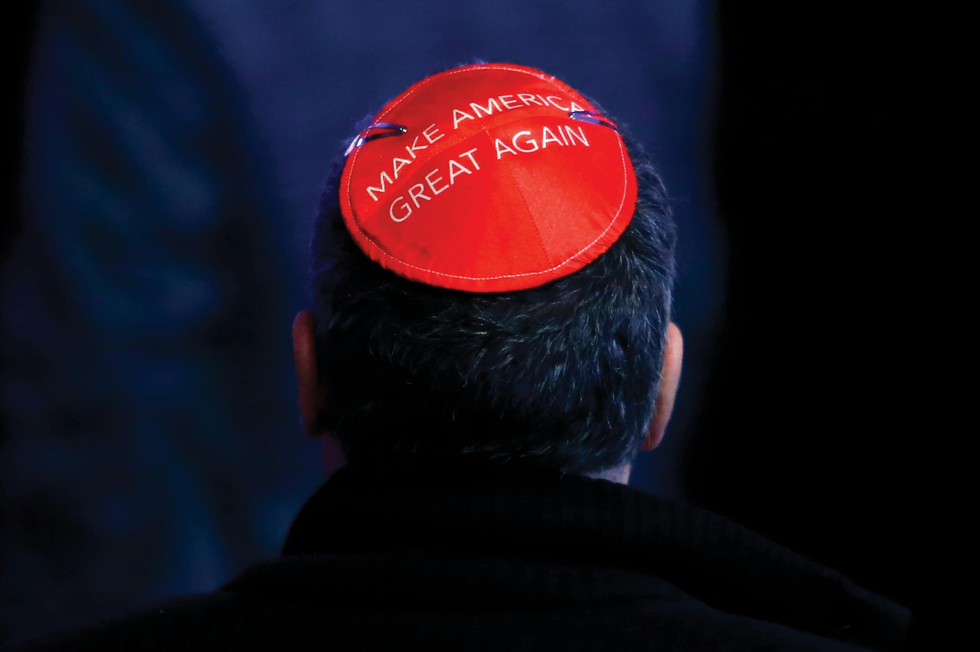A person wears a yarmulke with a Make American Great Again slogan