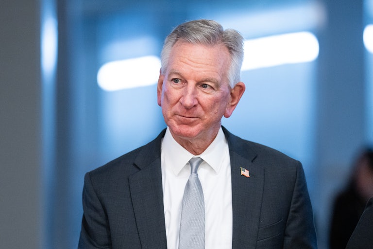 Senator Tommy Tuberville walks in the Capitol