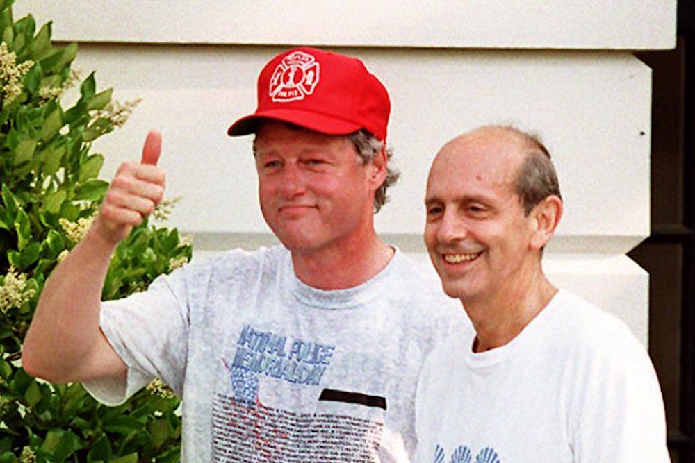 US President Bill Clinton (L) responds, in Washington, DC 16 May 1994, to reporters who asked if Judge Stephen Breyer (R) will be confirmed as the next US Supreme Court Judge. Judge Breyer joined the President for an early morning jog on the Mall.