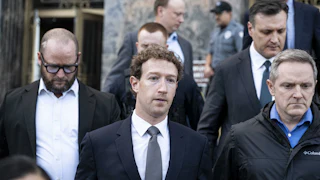 Meta CEO Mark Zuckerberg looks worried as he leaves court alongside other men.