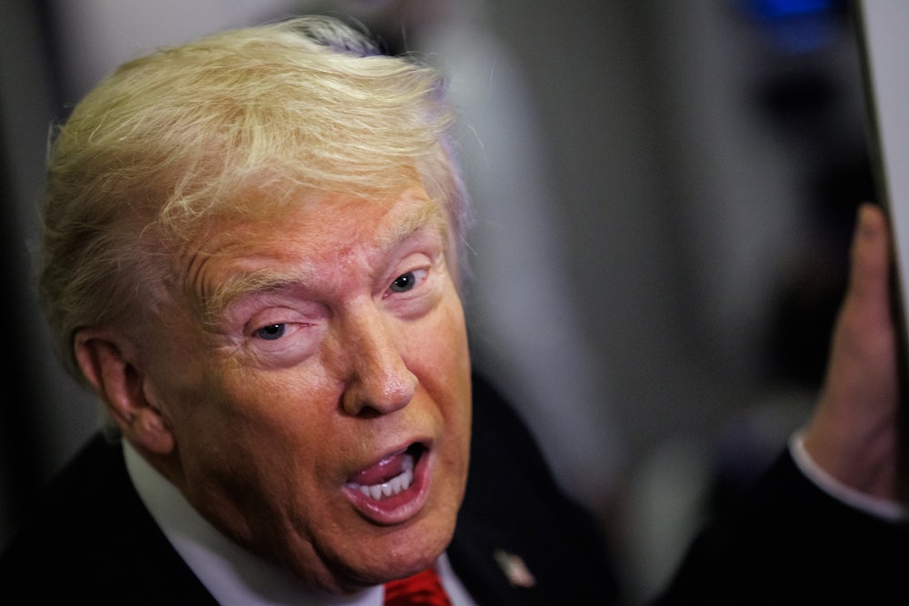 Donald Trump speaks to reporters on Air Force One