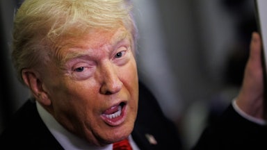 Donald Trump speaks to reporters on Air Force One