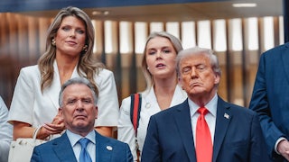 Lindsey Halligan and Karoline Leavitt stand next to each other, while Steve Witkoff and Donald Trump stand in front of them.