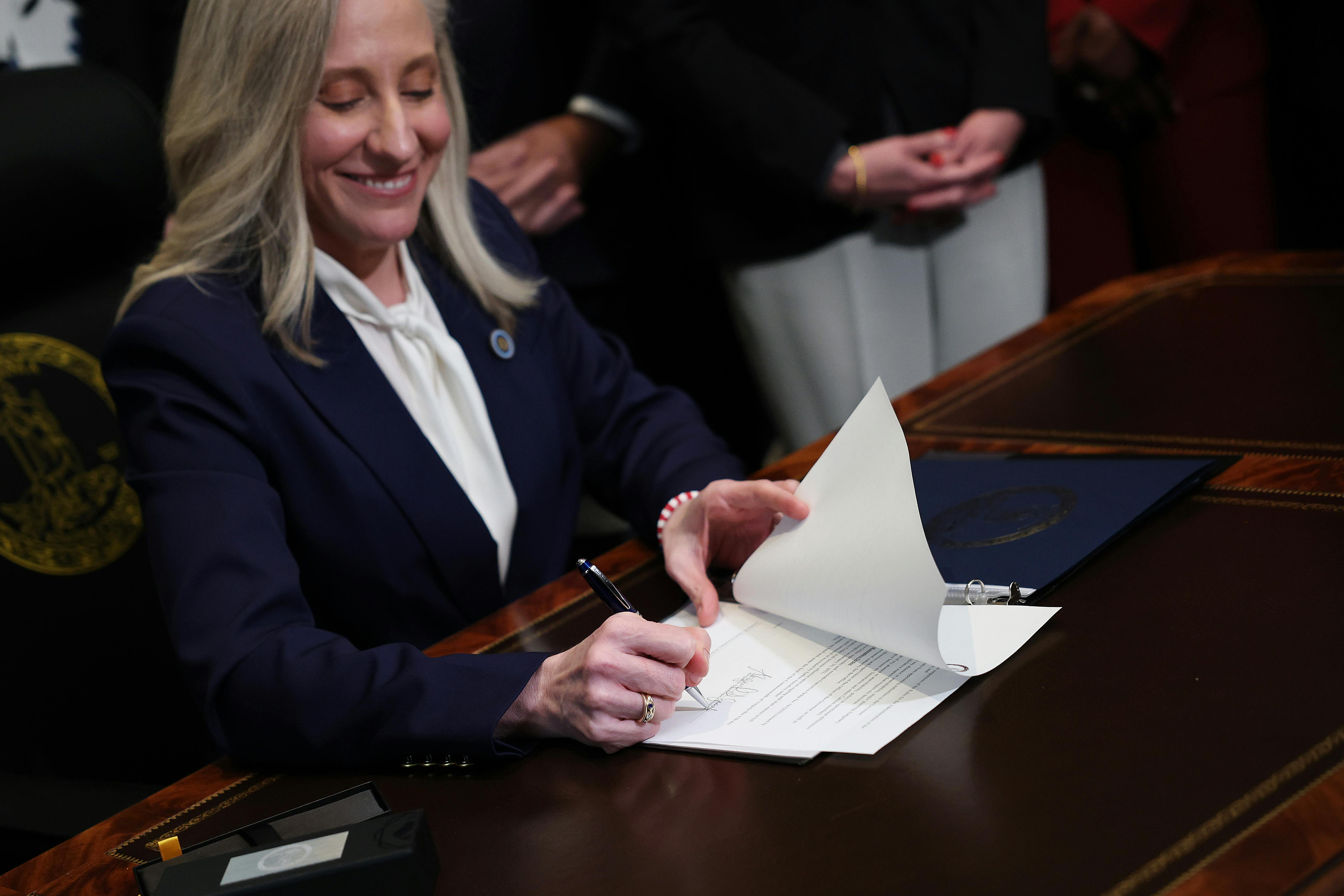 Virginia Governor Abigail Spanberger signs executive orders.