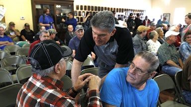Manchin shakes hands with coal miners