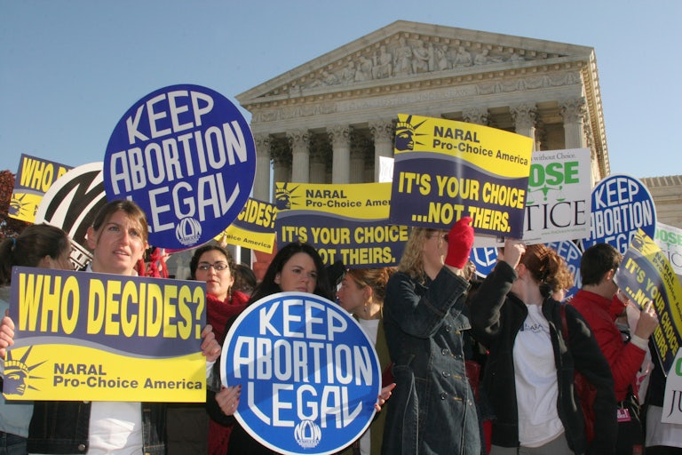 Pro-abortion rights protestors gather on the steps of the Supreme Court.
