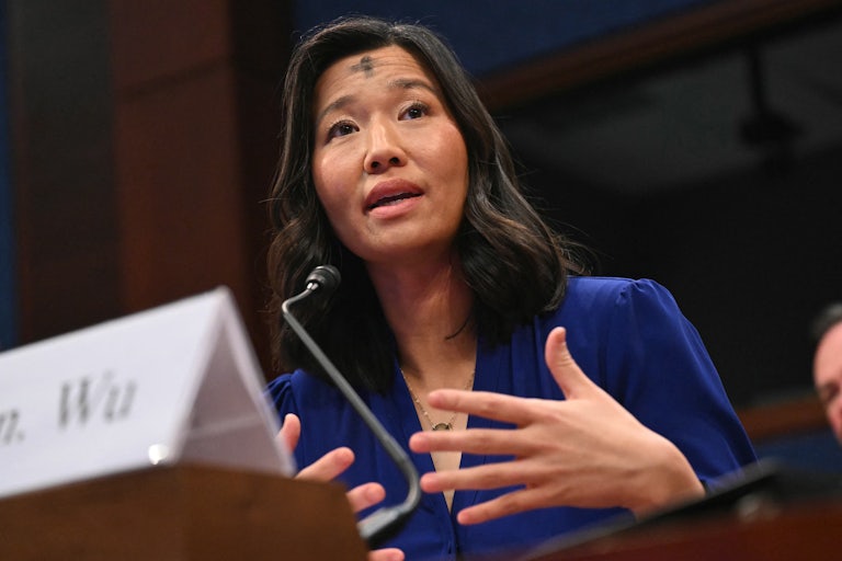 Boston Mayor Michelle Wu speaks at a congressional heaering on sanctuary cities. She has a cross on her forehead for Ash Wednesday.