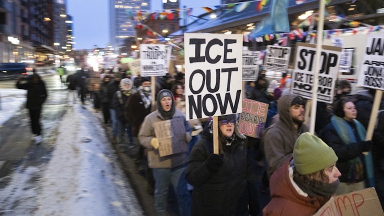 Demonstrators march during the nationwide “Stop ICE Terror” rally through downtown Minneapolis, Minnesota.