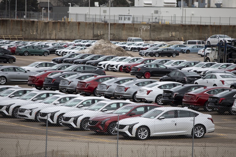 A parking lot full of General Motors cars.