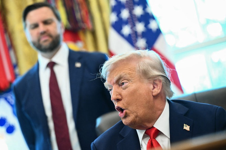 President Donald Trump and Vice President JD Vance stand in the Oval Office.