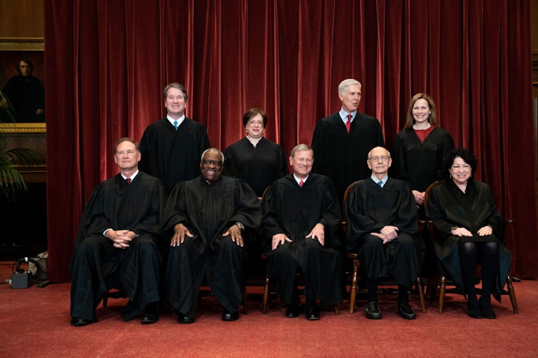 All the Supreme Court justices pose for a photo in their robes.