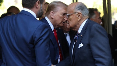 Donald Trump shakes hands with Rudy Giuliani