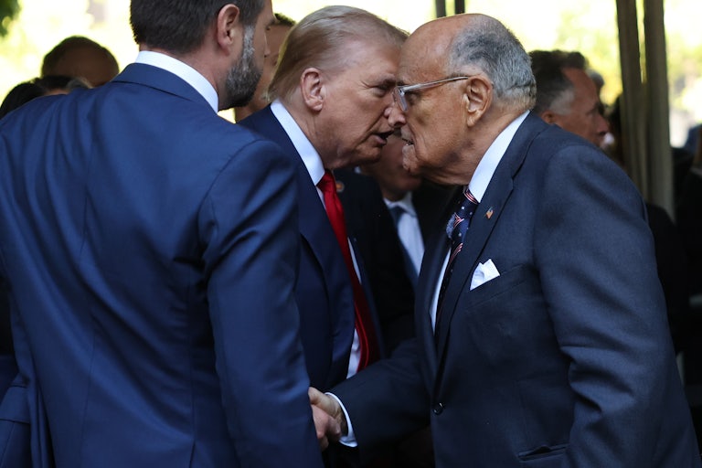 Donald Trump shakes hands with Rudy Giuliani