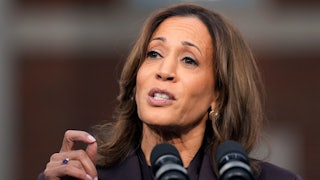 Kamala Harris speaks into microphones.