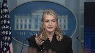 Press Secretary Karoline Leavitt gestures while standing at the podium in the White House press briefing room