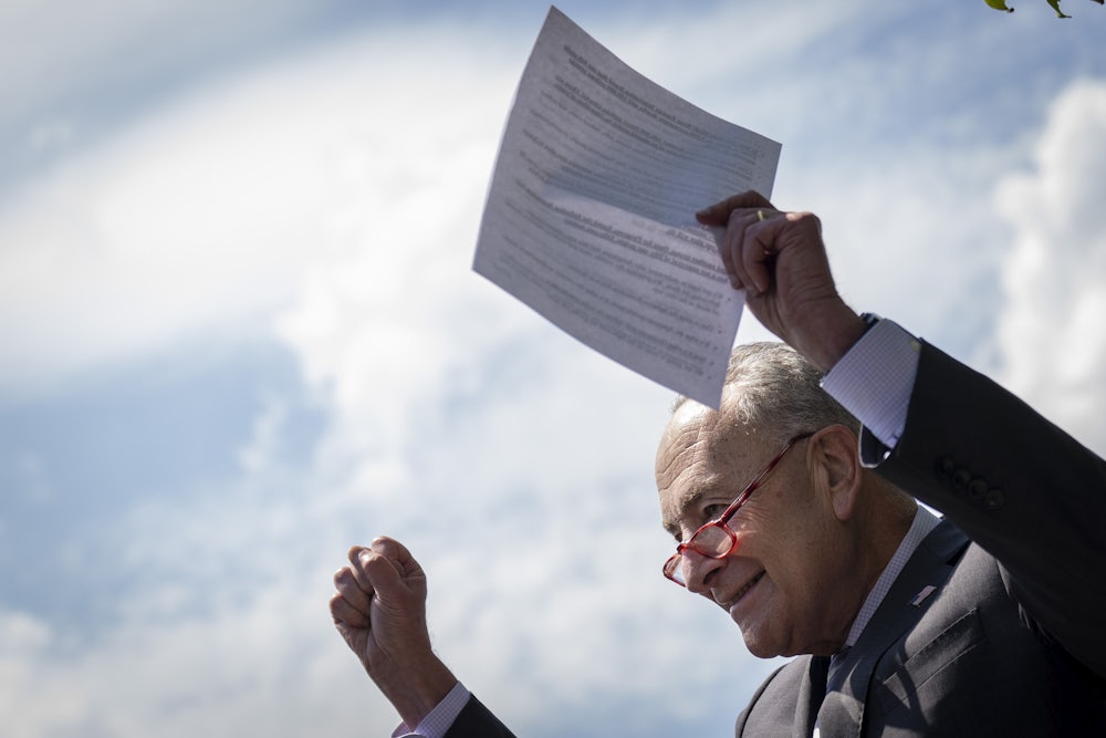 Senate Majority Leader Chuck Schumer arrives at an August press conference with news about the Inflation Reduction Act, which passed the Senate days later.